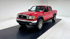 Red 1st gen Toyota Tacoma double cab